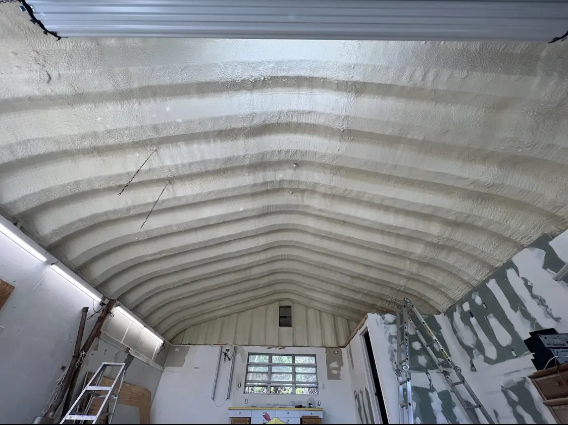 Spray polyurethane foam applied to the underside of a metal roof deck in Nanakuli
